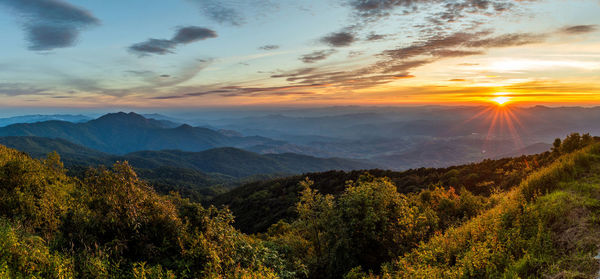 Scenic view of landscape against sky during sunset