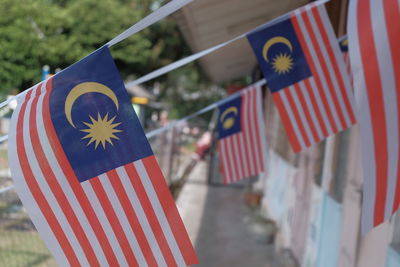 Close-up of malaysian flags on houses