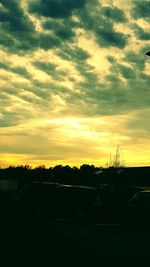 Scenic view of landscape against cloudy sky