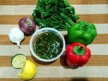 Fruits and vegetables in bowl on table