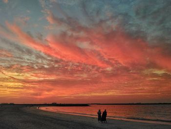 Scenic view of beach against sky during sunset