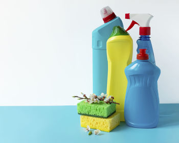 Close-up of multi colored bottle against white background