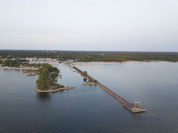 High angle view of pier amidst lake against sky