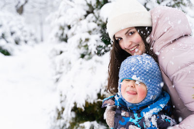 Portrait of a smiling woman in snow