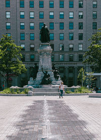 Statue against building