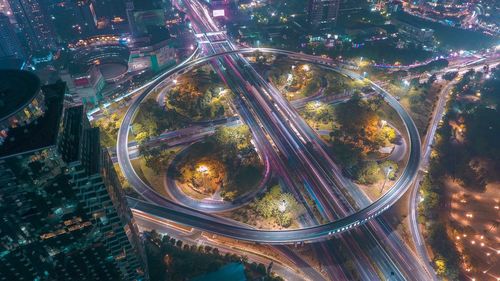 High angle view of light trails on road at night