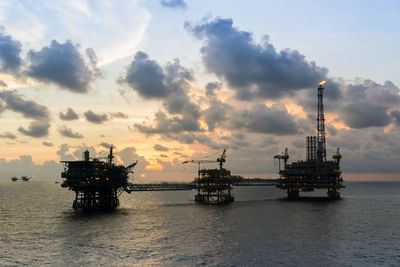 Silhouette of oil production platform during sunset at offshore terengganu oil field