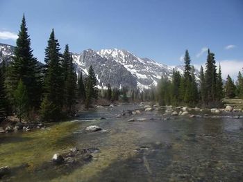 Scenic view of lake with mountains in background