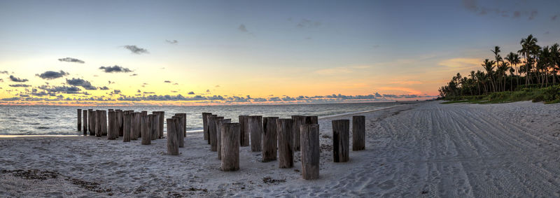 Scenic view of beach against sky during sunset