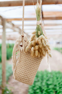 Close-up of rope tied up on wood