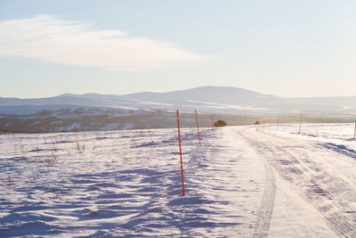 Scenic view of land against sky during winter