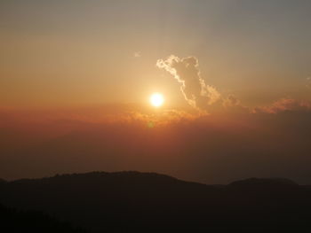 Scenic view of silhouette mountain against sky during sunset