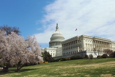 Low angle view of state capitol building against sky during sunny day