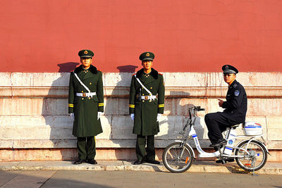 Bicycles parked against wall