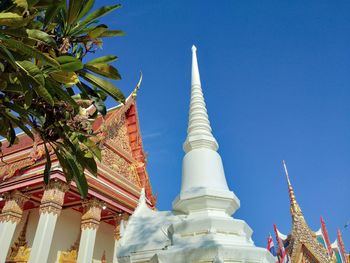 Low angle view of building against blue sky