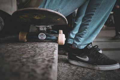 Low section of man standing on skateboard