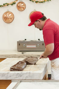 Midsection of man preparing food