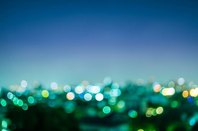 Defocused image of illuminated lights at night