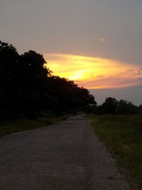 Empty road at sunset