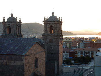 View of buildings in city against clear sky