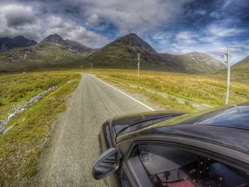 Road passing through field