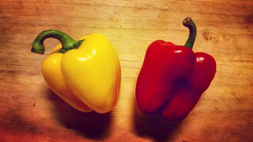 Yellow bell peppers on table