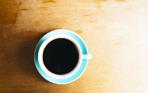 Directly above shot of coffee cup on table