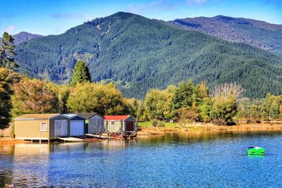 Scenic view of calm lake with mountains in background