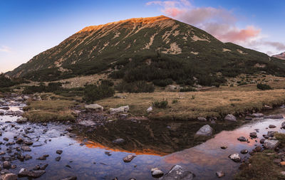 Scenic view of landscape and mountains against sky