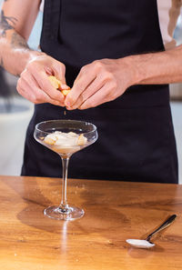 Midsection of man preparing food on table