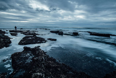 Scenic view of sea against cloudy sky