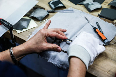 High angle view of man working on paper