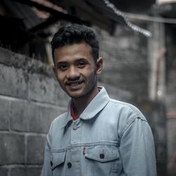 Portrait of young man standing outdoors