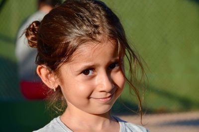 Close-up portrait of smiling cute girl