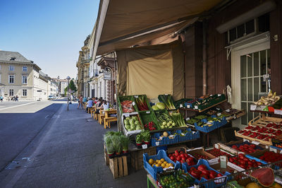 Street market against buildings in city