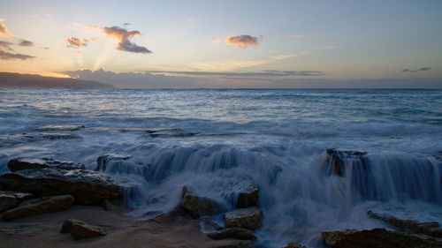 Scenic view of sea against sky during sunset