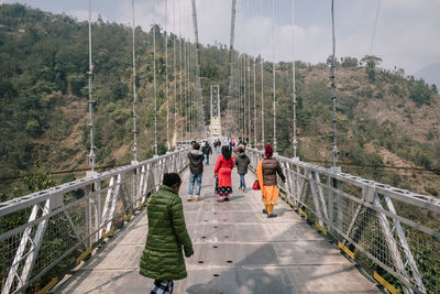 People walking on footbridge