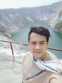 Portrait of man standing on mountain