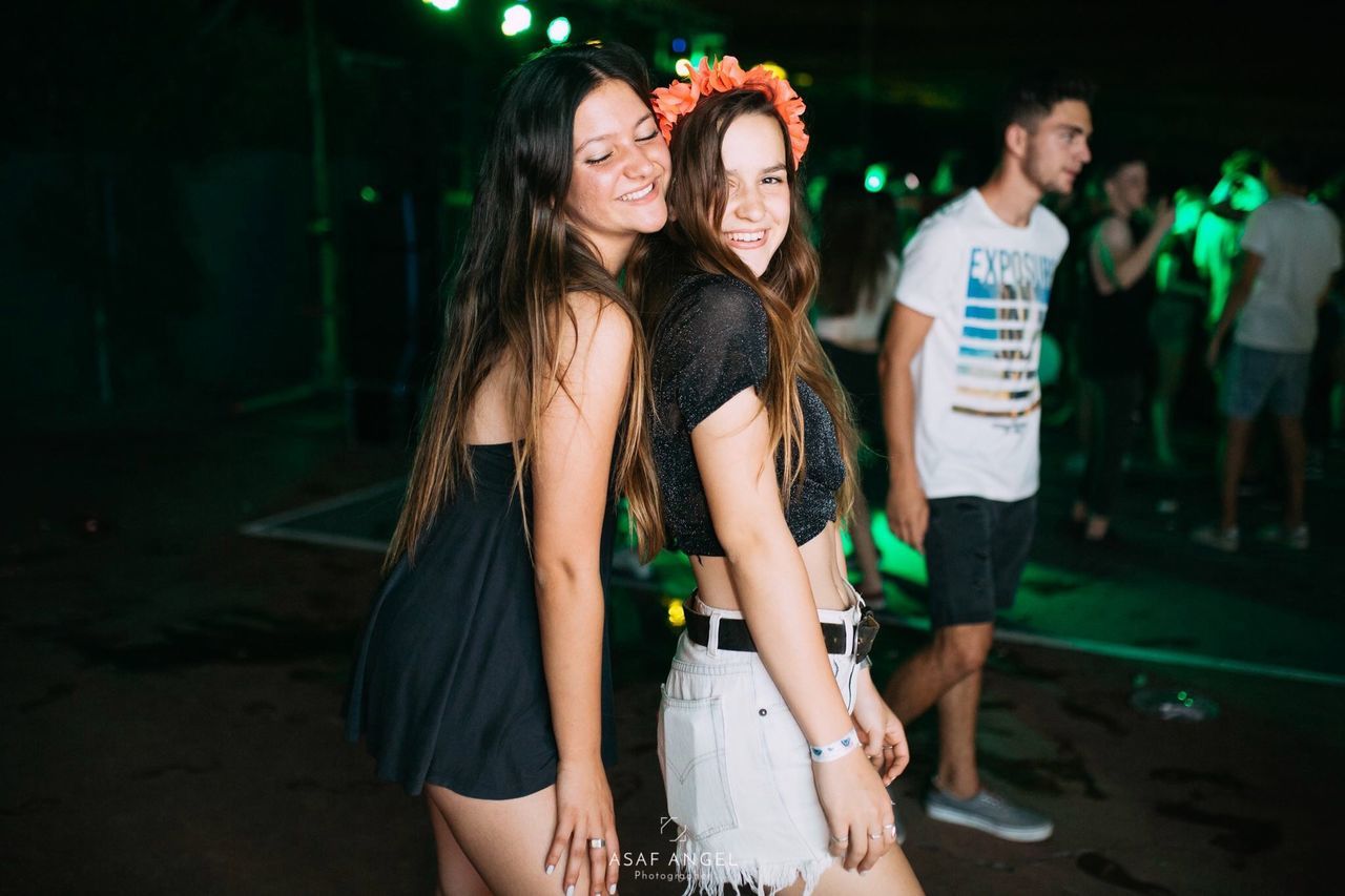 togetherness, group of people, night, young adult, young women, friendship, women, happiness, adult, emotion, event, nightlife, fun, smiling, leisure activity, enjoyment, long hair, party - social event, young men, hairstyle, positive emotion, couple - relationship