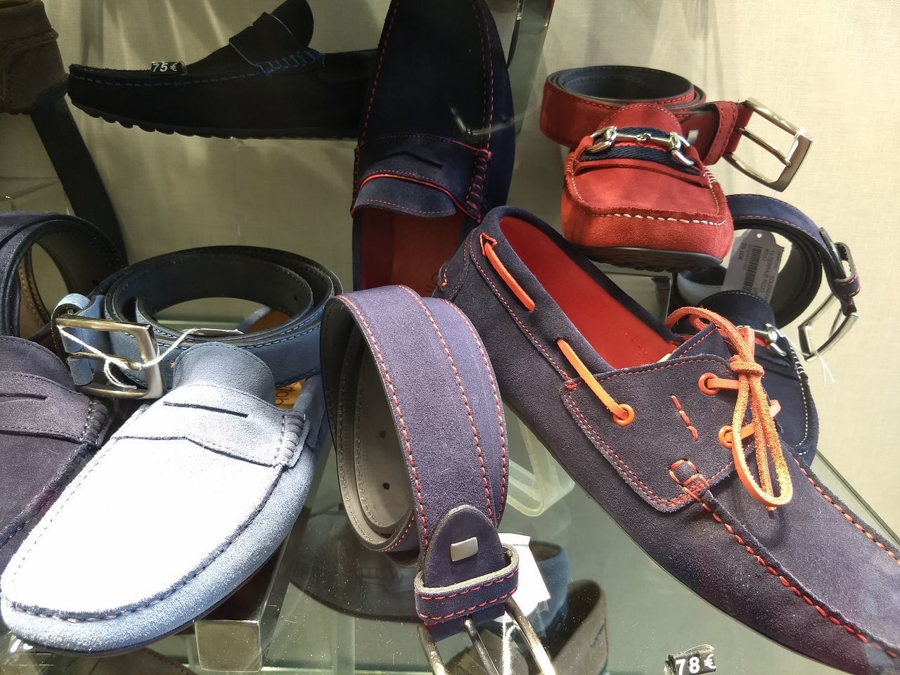 HIGH ANGLE VIEW OF VARIOUS SHOES HANGING