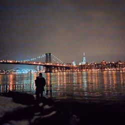Bridge over river at night