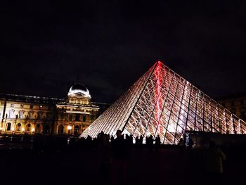 Low angle view of illuminated city at night