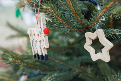 Diy wood clothespin decoration on christmas tree
