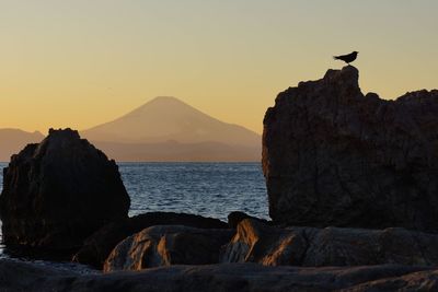 Scenic view of calm sea at sunset