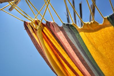 Close-up of colorful hammock hanging against clear sky
