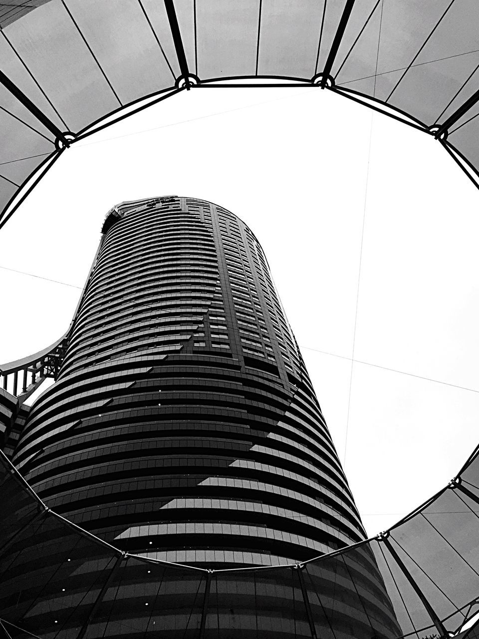 architecture, built structure, low angle view, building exterior, modern, pattern, clear sky, office building, building, city, sky, glass - material, architectural feature, repetition, day, no people, design, geometric shape, directly below, indoors