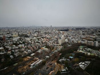 Aerial view of cityscape against sky