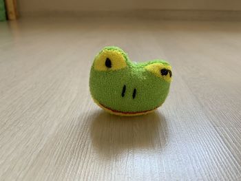 Funny frog  toy on table