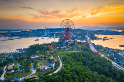 High angle view of ferris wheel in city