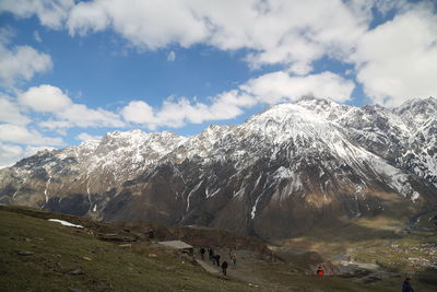 Scenic view of snowcapped mountains against sky